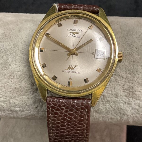 Vintage Longines gents automatic wristwatch with gold tone case and brown strap