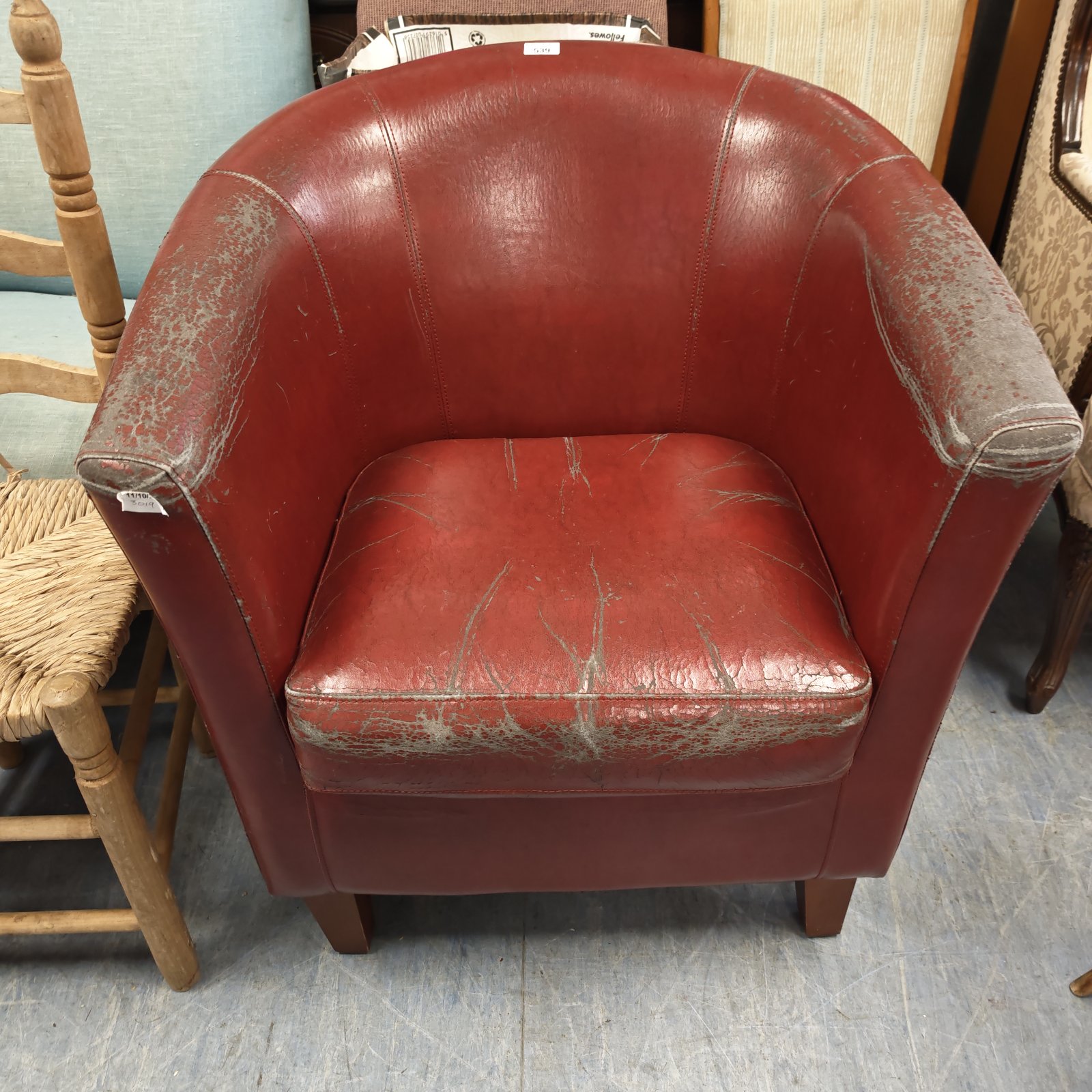 Red leather tub chair with worn leather to be re-up holstered