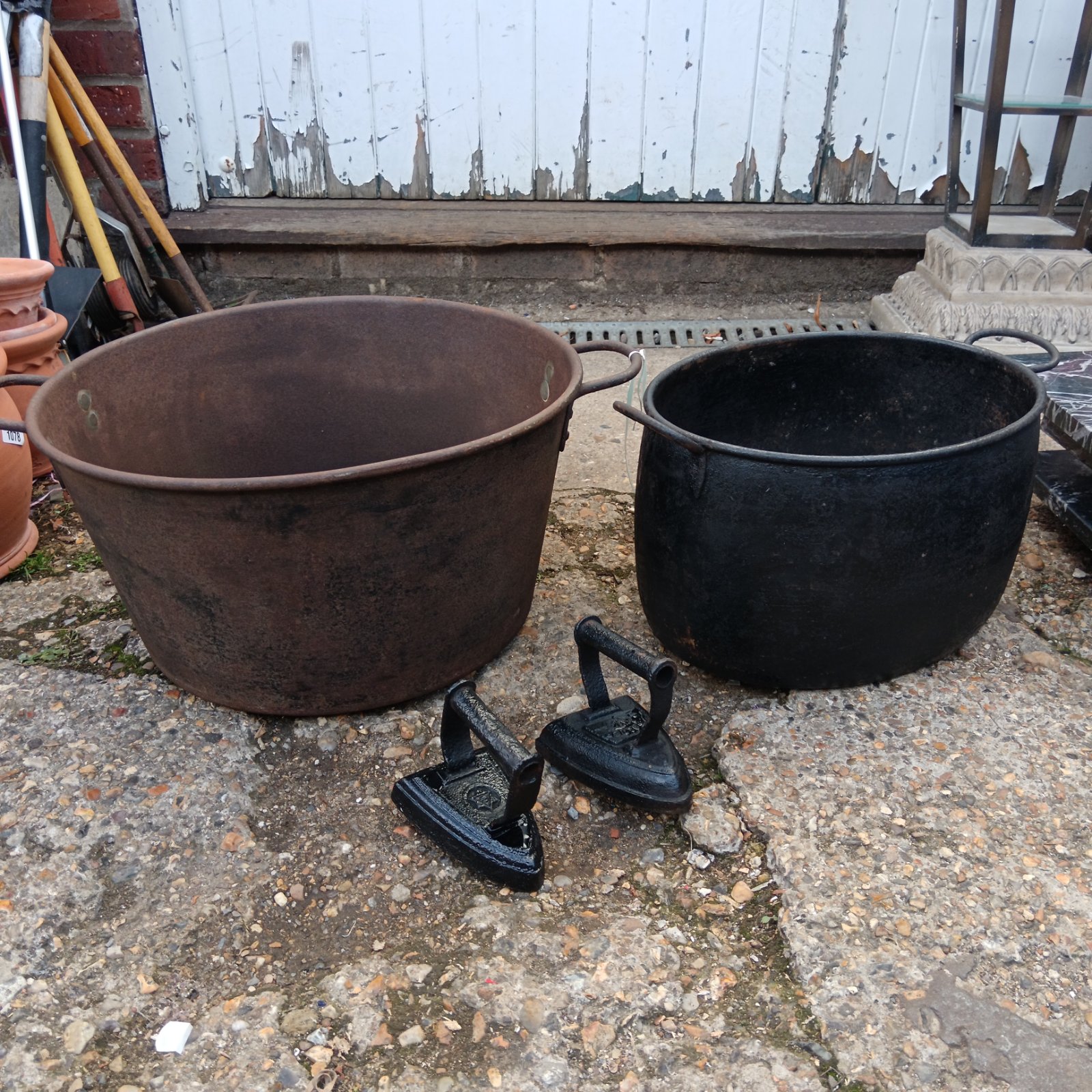 Cast iron cookpot tin tub and two flat irons