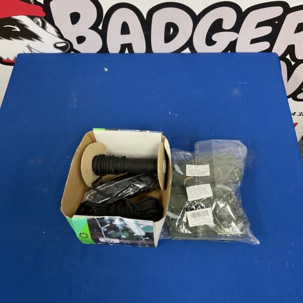 Bundle of nylon webbing straps along with black elastic shock cord