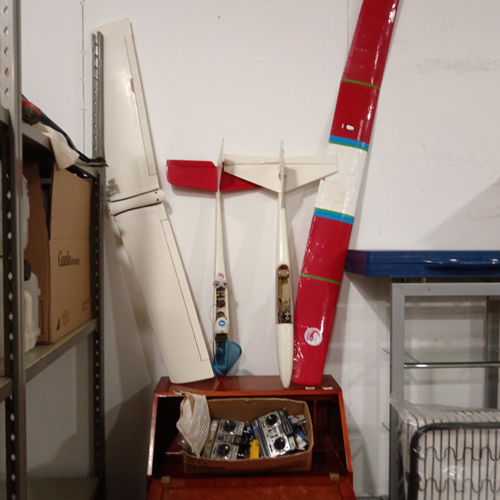 Two rc model planes and accessories including futaba controller units