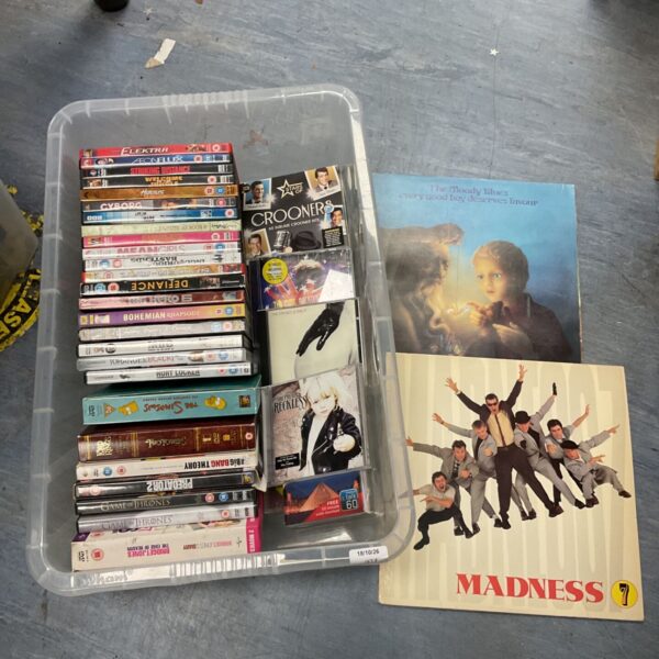 Mixed lot of Madness and Moody Blues DVDs, CDs and vinyl records.