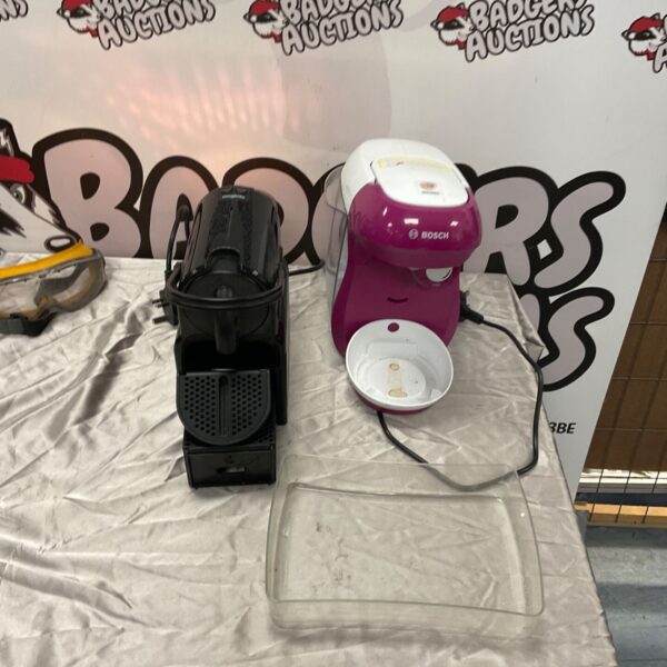 Black Magimix espresso machine beside pink and white Bosch water heater on table