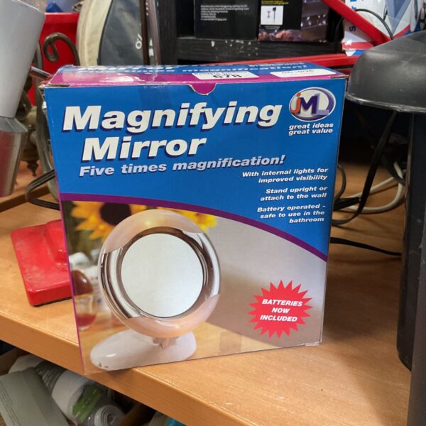 Vintage lighted magnifying mirror with packaging.