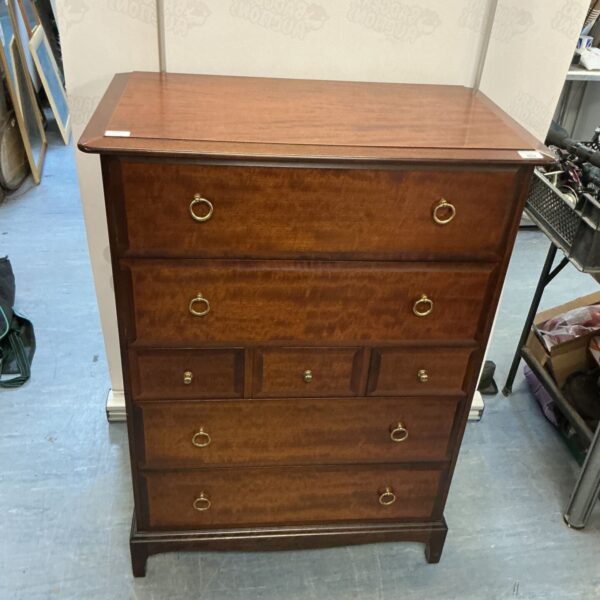 Antique mahogany chest of drawers with two over three drawer configuration.