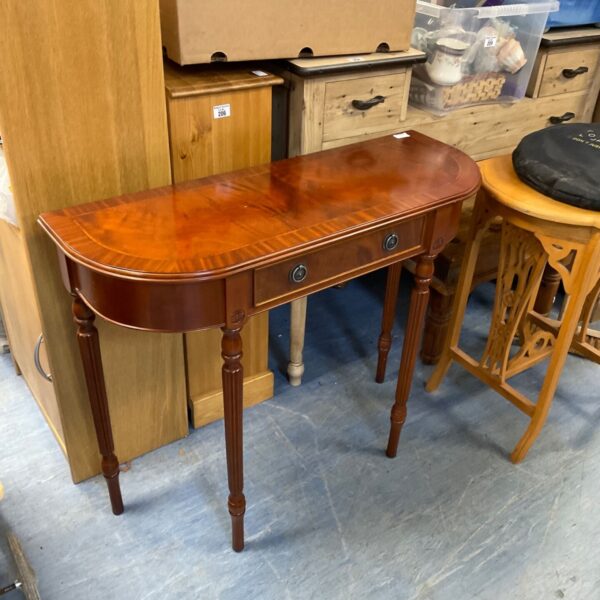 Small mahogany inlaid console table with a single drawer.
