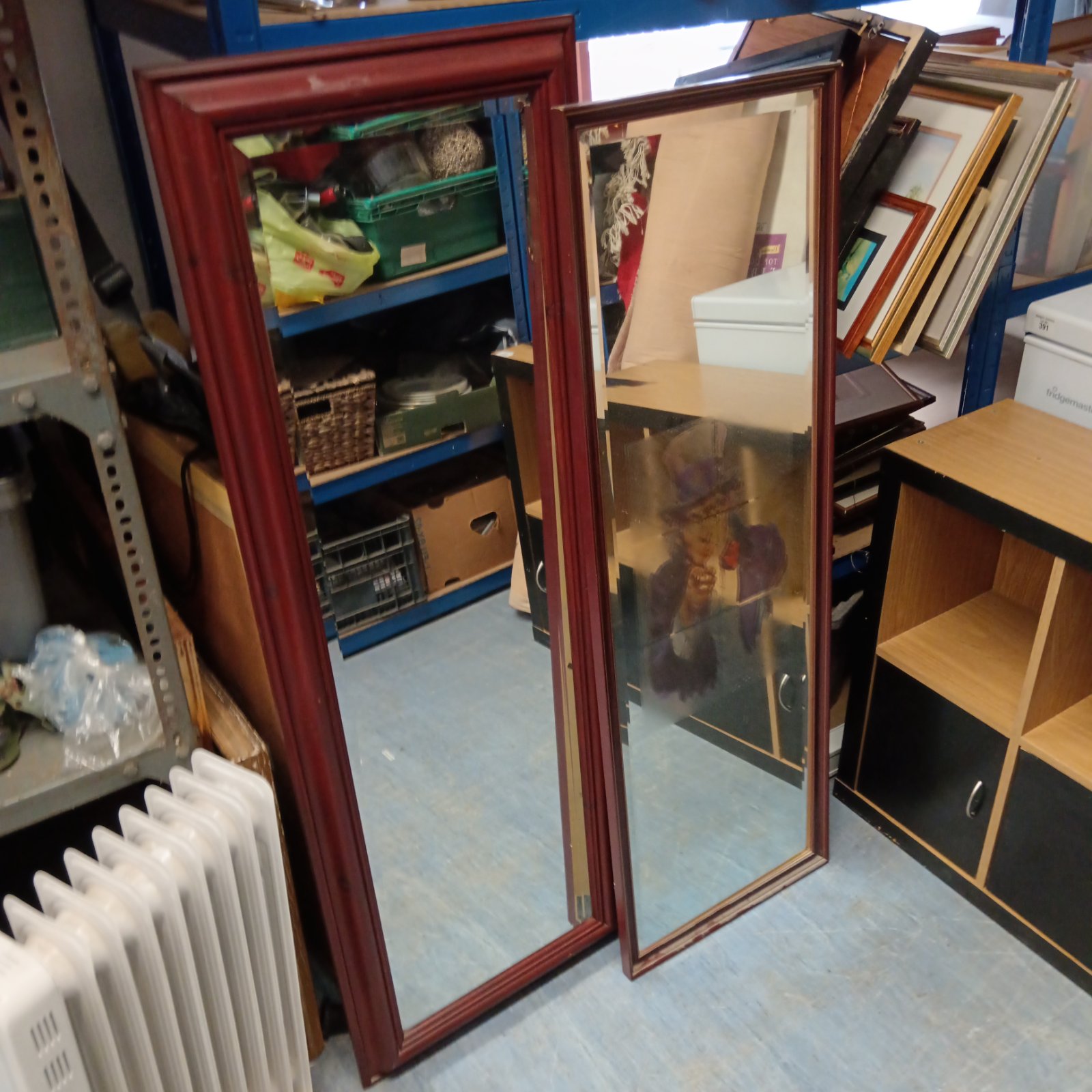 Two antique mahogany framed wall mirrors for home decor.