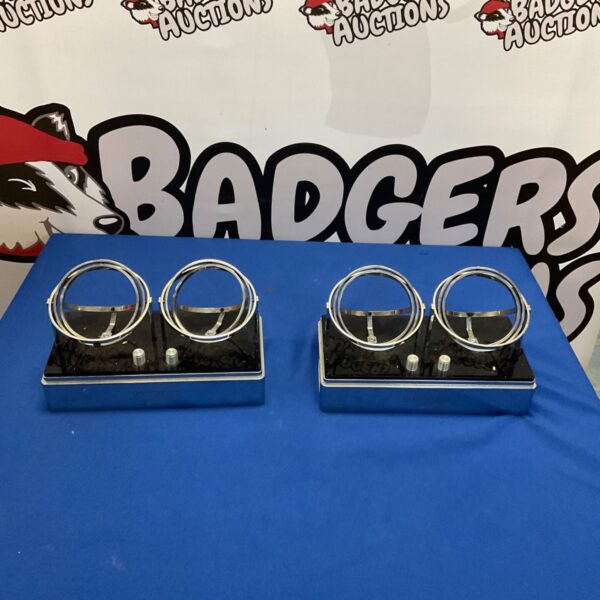 Two black Mainspring Orbit watch winders displaying automatic watches.