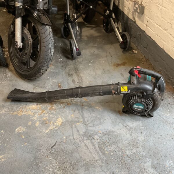 Makita BHX2501 petrol blower with long tube and teal housing