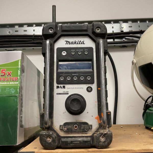Makita DMR104 DAB job site radio with antenna and chrome carrying handles