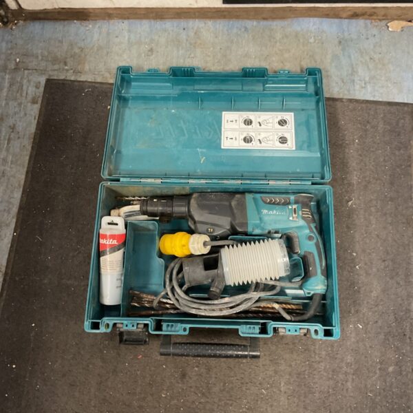 Makita SDS-Plus hammer drill in open carrying case.