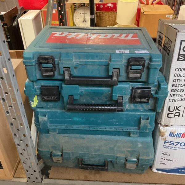 Blue Makita tool case for power tools, showing signs of wear.