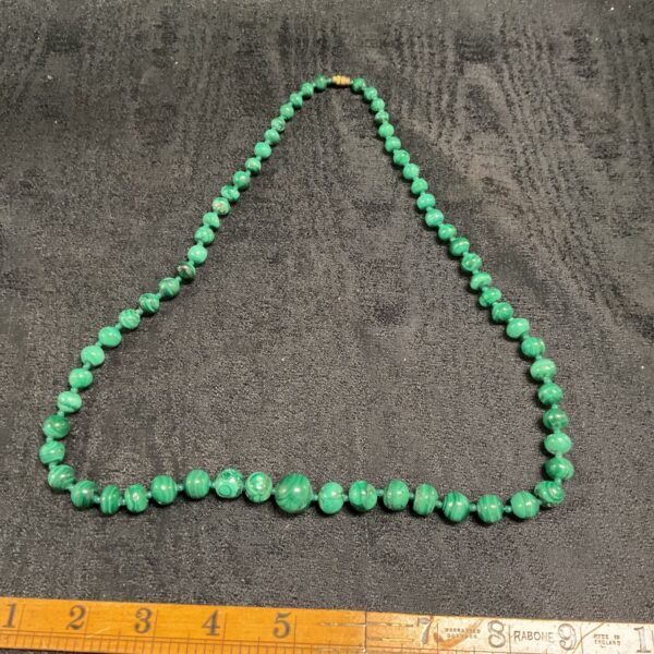 Graduated green malachite bead necklace with metal clasp, 24 inches long