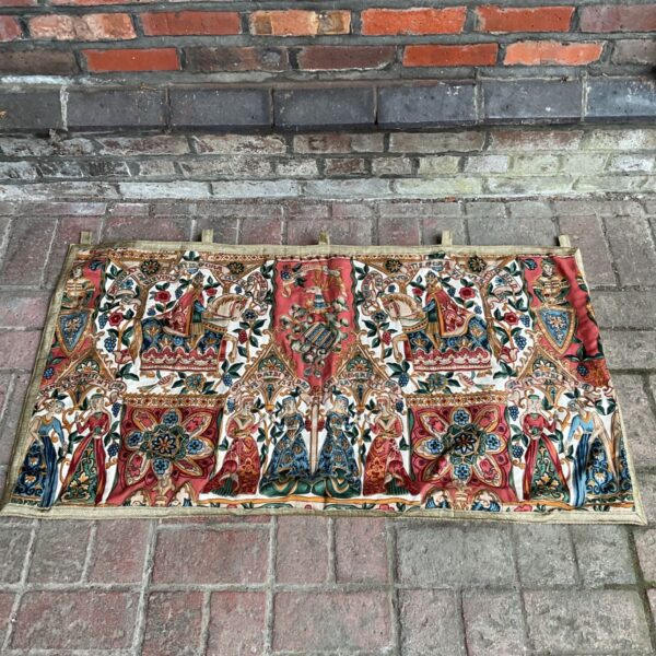 Intricate medieval revival Jacquard tapestry with floral and heraldic designs.