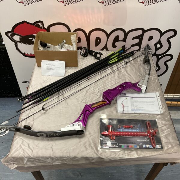 Merlin MA 2000 compound bow with arrows and archery accessories on table