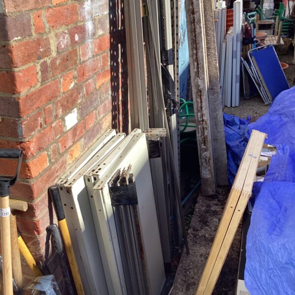 Used metal storage rack set components for garage or workshop.