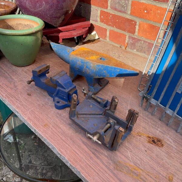Vintage metal vise for workshop use, ideal for metalworking projects.