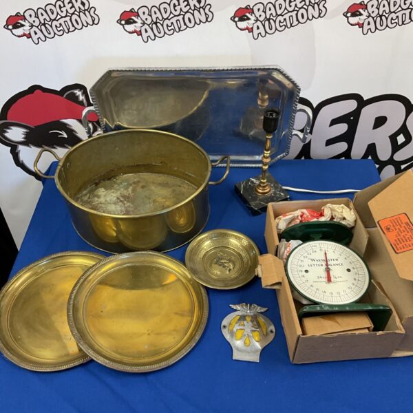 Vintage metalware lot featuring brass plates, letter scales and an AA badge.