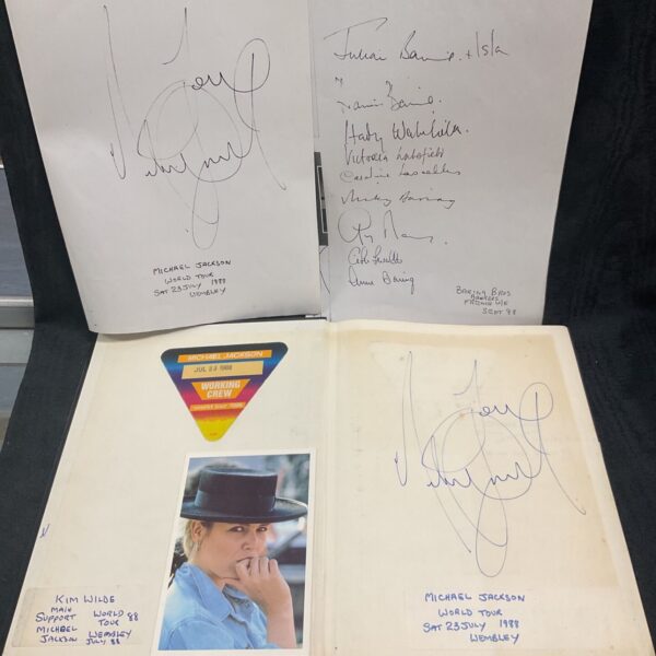 Michael Jackson autograph book cover with signatures.