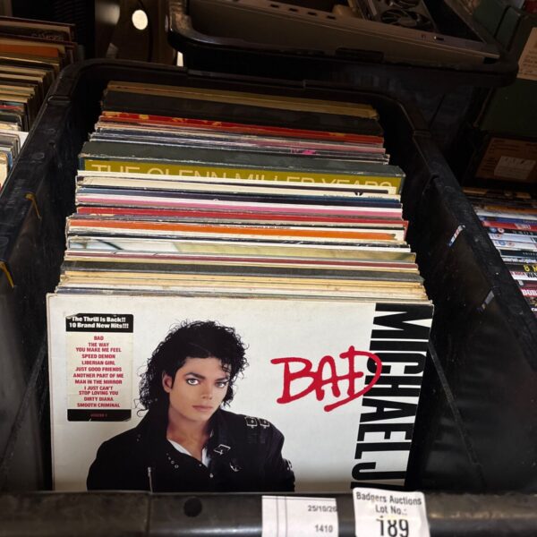 Crate of mixed 12 inch vinyl records with Michael Jackson Bad album on top