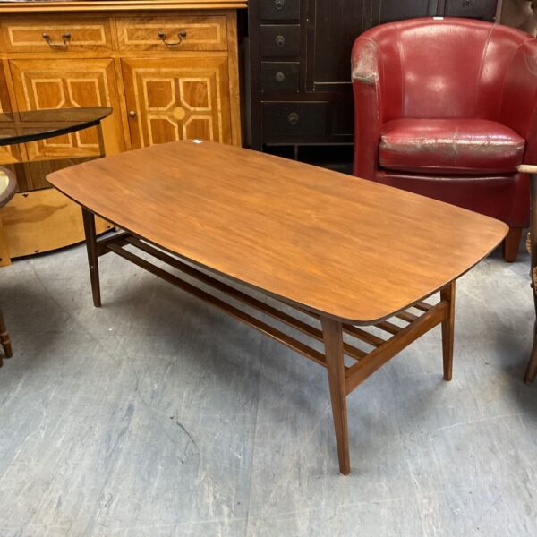 Large mid-century Danish style coffee table with magazine rack.