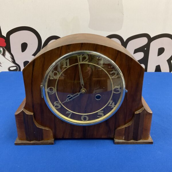 Mid century walnut veneer mantle clock with arched top and chrome bezel