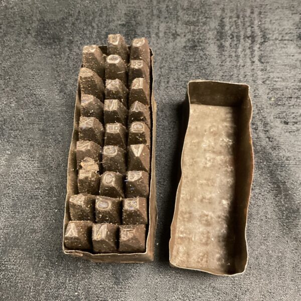Set of military letter punches with Cyrillic characters in metal box