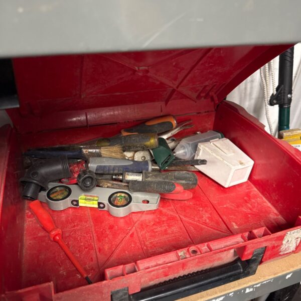 Vintage Milwaukee tool case filled with various hand tools for DIY projects.