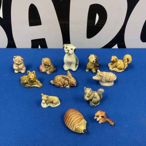 Vintage miniature animal ornaments, including Wade whimsies, in a collectible lot.
