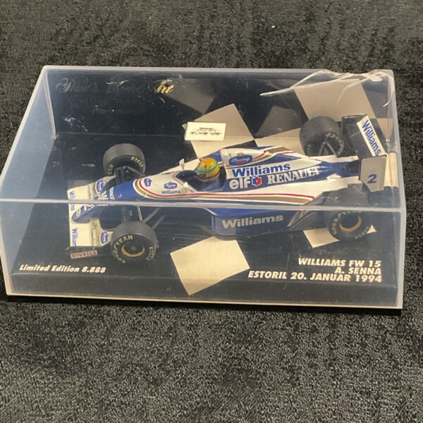 Minichamps Williams FW15 Ayrton Senna Estoril 1994 model car in display case.