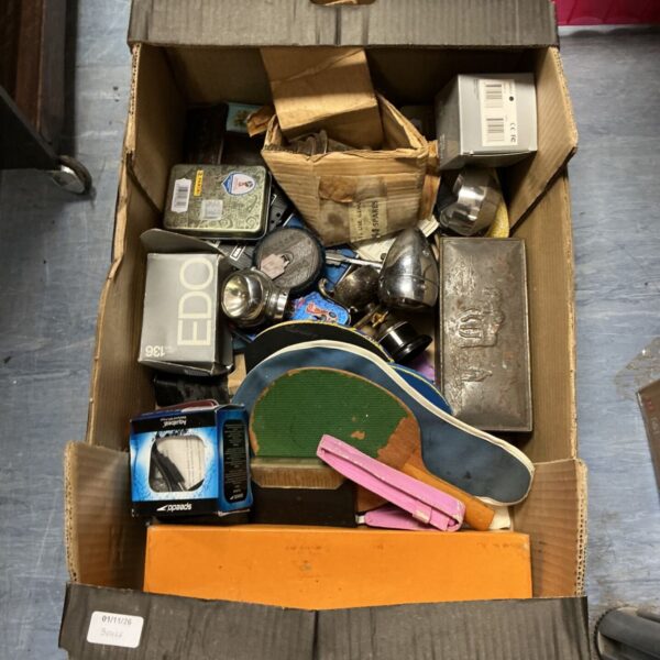 Mixed box lot with table tennis paddles, Speedo Aquabeat MP3 player and tins