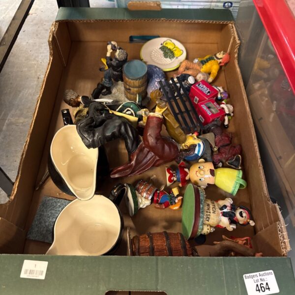 Tray of mixed collectibles including egg cups and figurines.