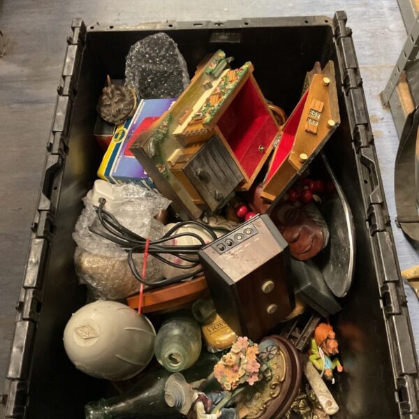 Black crate of mixed decorative ornaments, wooden box, glass bottles and figures