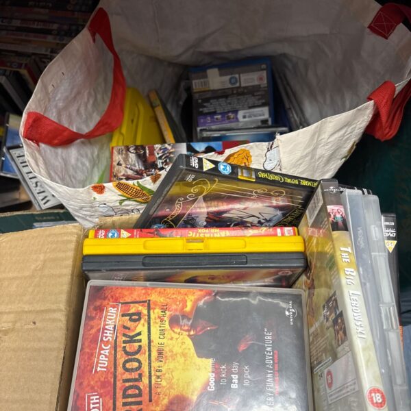 Bag and cardboard box of mixed DVDs including Gridlock'd and The Big Lebowski