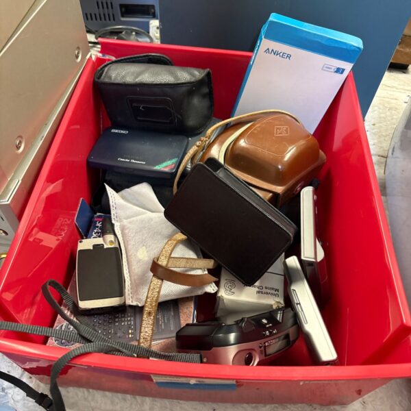 Mixed electrical lot with vintage cameras and a Seiko calculator.