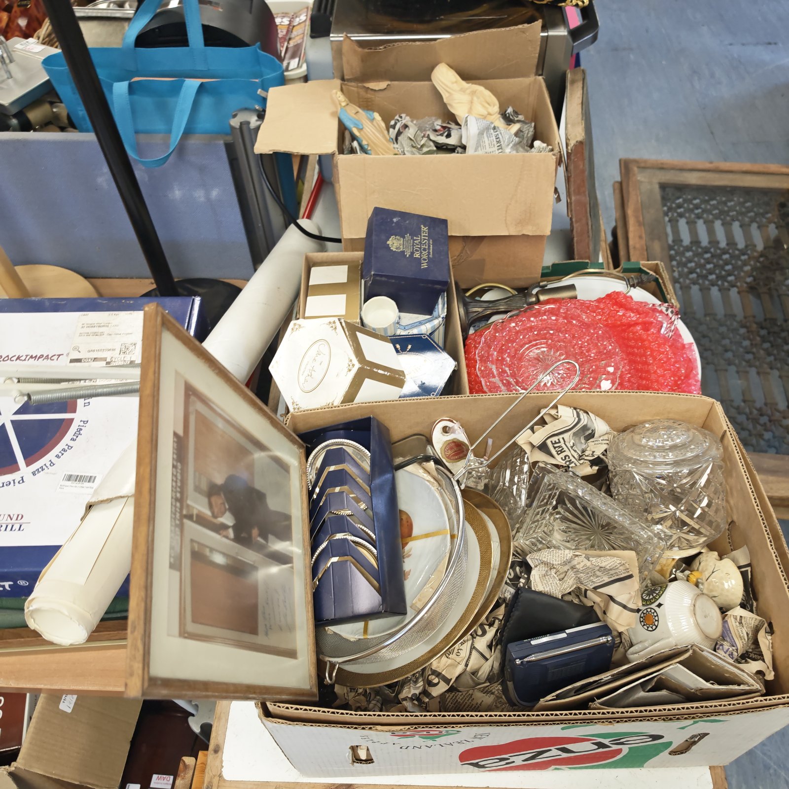 Mixed lot of vintage glassware and china plates in cardboard boxes.