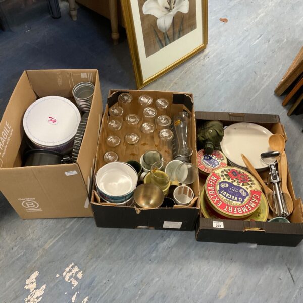 Three boxes of mixed kitchenware with pint glasses, cake tins and tins