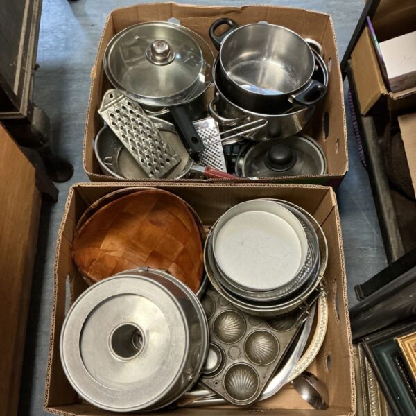 Two boxes of mixed kitchenware including stainless steel pans, cake tins and wooden bowls