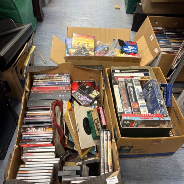 Mixed media lot of CDs, VHS tapes, cassettes and vinyl records.