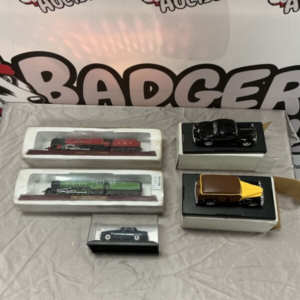 Boxed Duchess LMS and Flying Scotsman model trains with diecast cars and Rover model