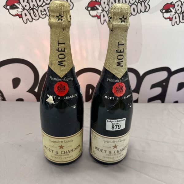 Two bottles of vintage Moet & Chandon Premier Cuvee champagne.