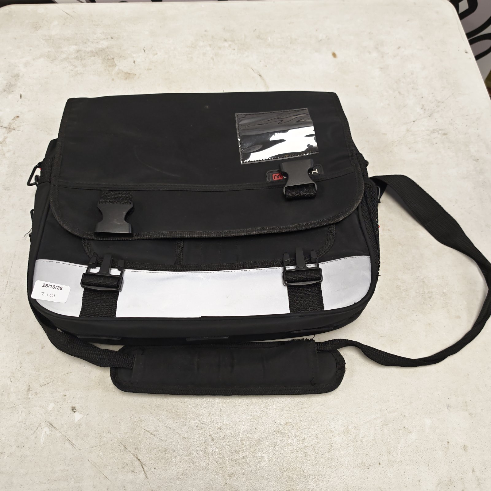 Black Monolith laptop bag with reflective band and shoulder strap