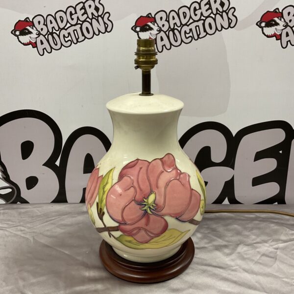 Moorcroft magnolia pattern table lamp with pink flowers on cream ground