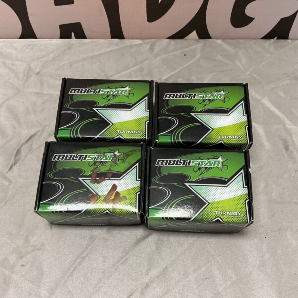 Four boxed MultiStar Turnigy brushless multi-rotor outrunners on a grey surface