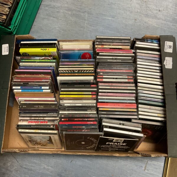 Box of assorted music CDs including David Bowie albums.
