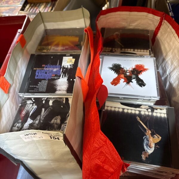 Mixed music CD lot with visible album cover.
