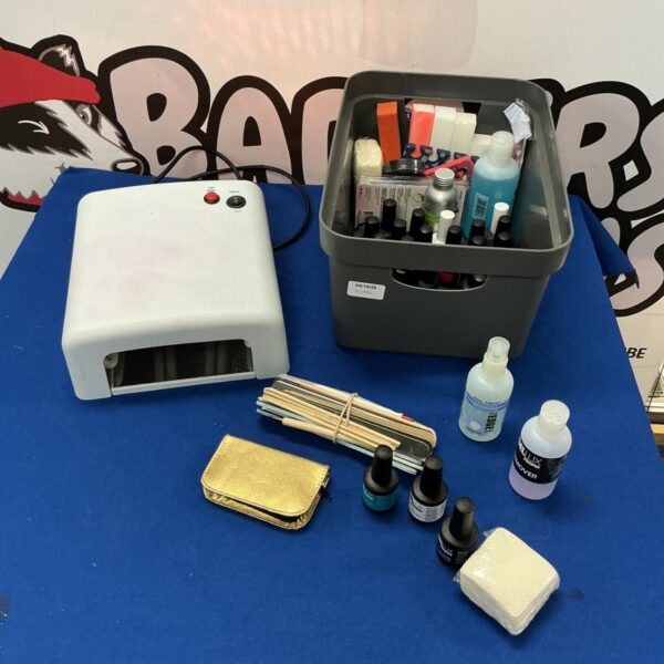 White nail polish dryer with a beauty product lot.
