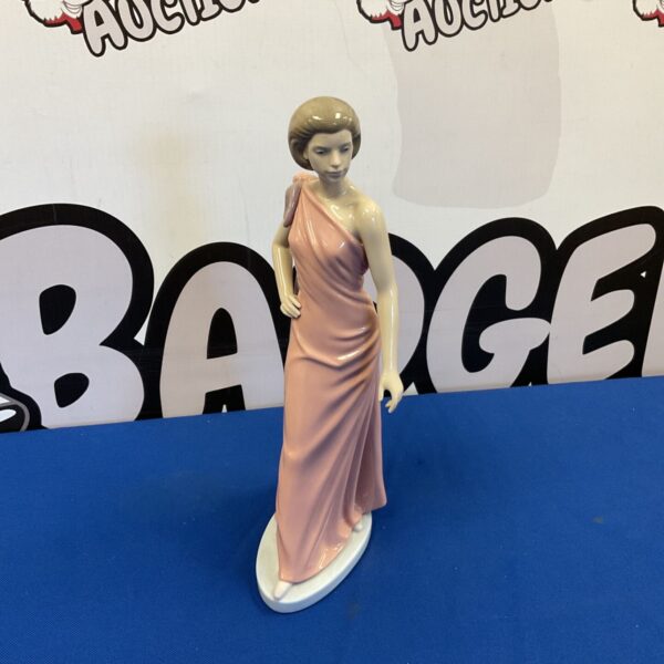 Nao "Flirtatious" figurine, a delicate porcelain sculpture for collectors.