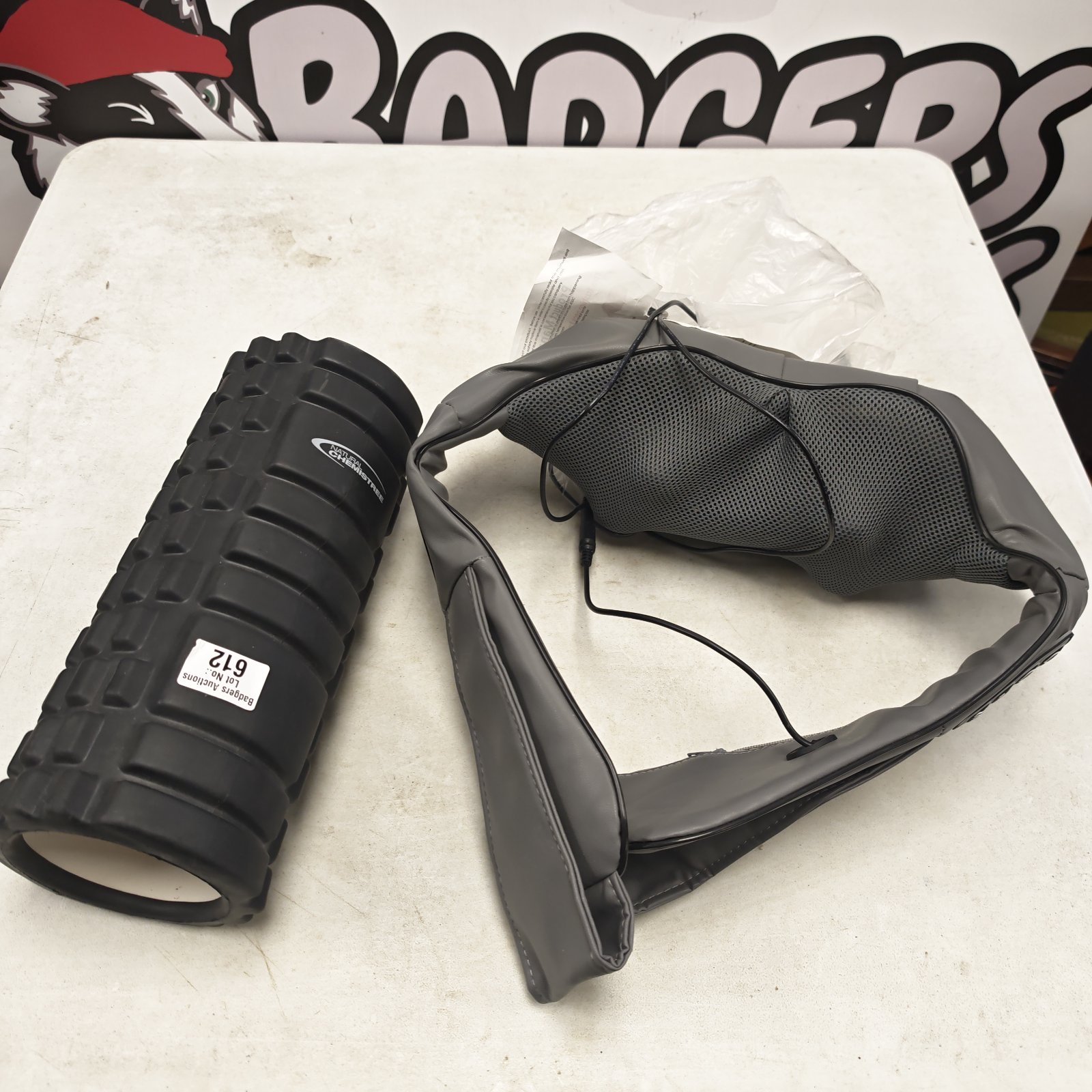 Natural Chemistry black foam back roller beside grey neck kneading massager