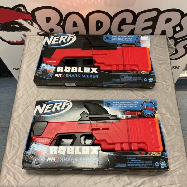Two boxed Nerf Roblox MM2 Shark Seeker toy blasters with shark fin priming